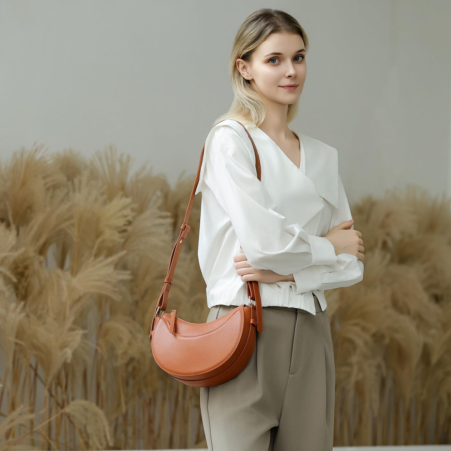 Herald Small Leather Crossbody Bag for Women, Designer Crescent Shoulder Purse Handbag with Adjustable Strap & Tassel (Brown)